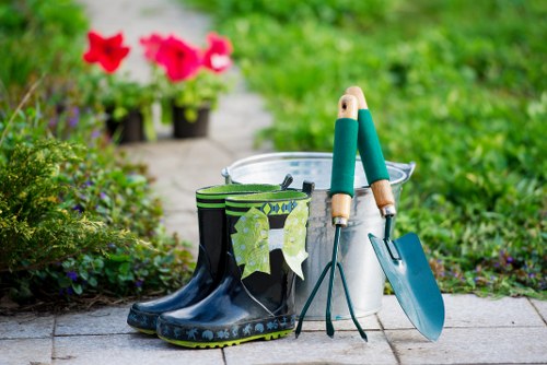 Professional gardener trimming hedges in a Kentish Town garden